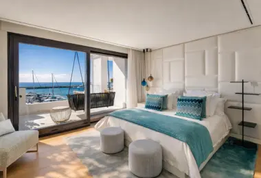 Apartment for sale Marbella Spain – Puerto Banús luxury bedroom with marina view terrace and Mediterranean sea views
