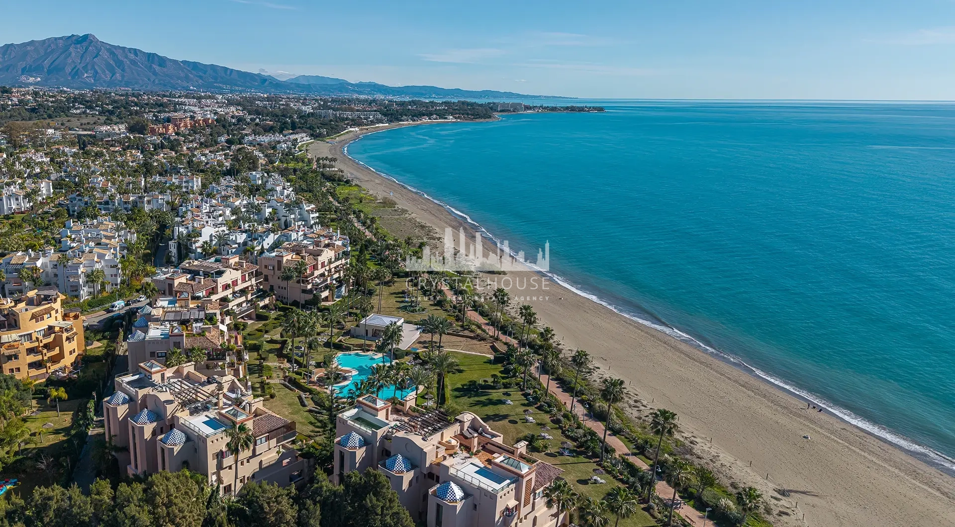 Luxury beachfront apartment in Estepona seaside residential complex with pool and sandy beach
