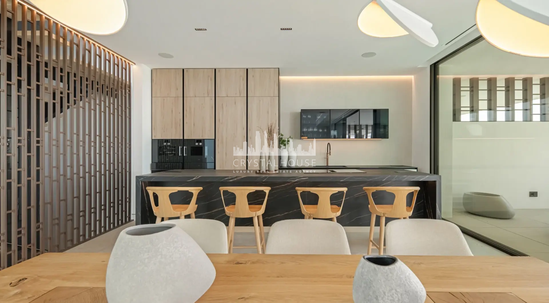 Luxury villa Marbella Golden Mile modern kitchen and dining area with minimalist interior design